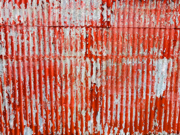 Textura de pared metálica roja vieja oxidada