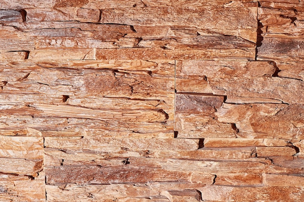 Foto textura de pared de piedra con luz dura, primer plano