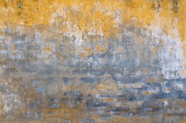 Textura de pared pintada de amarillo viejo