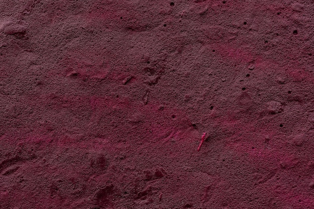 Textura de pared roja Textura áspera hormigón rojo La superficie está pintada con un aerosol
