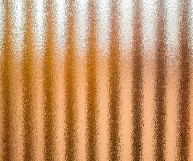 Textura de pared de vidrio con luces doradas para el fondo