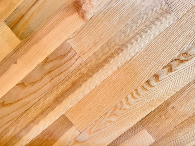 Foto la textura del parquet de madera en el piso está hecha de componentes rectangulares