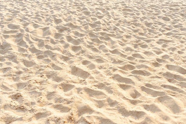 Textura de patrón de arena en playa tropical como fondo. Playa al aire libre en verano.