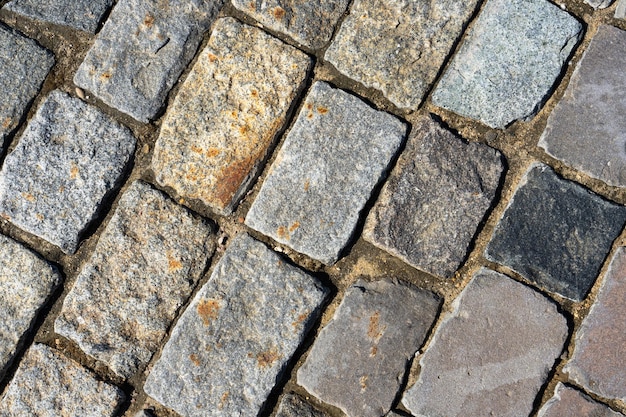 La textura del pavimento de piedra Fondo del pavimento de adoquines de granito Resumen de antecedentes
