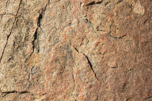 Textura de piedra de granito Pared de granito de piedra natural con estructura rugosa Fondo de granito