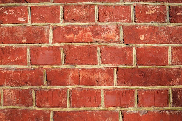 Foto textura de piedra de pared de ladrillo rojo