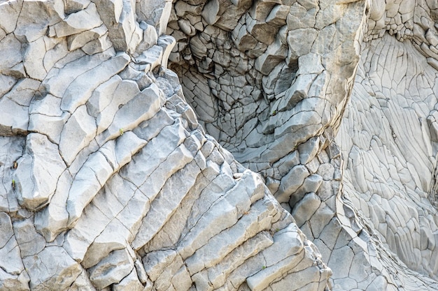 Textura de piedra volcánica Laderas de piedra del desfiladero de Alcantara formadas por lava de la isla del Monte Etna Sicilia