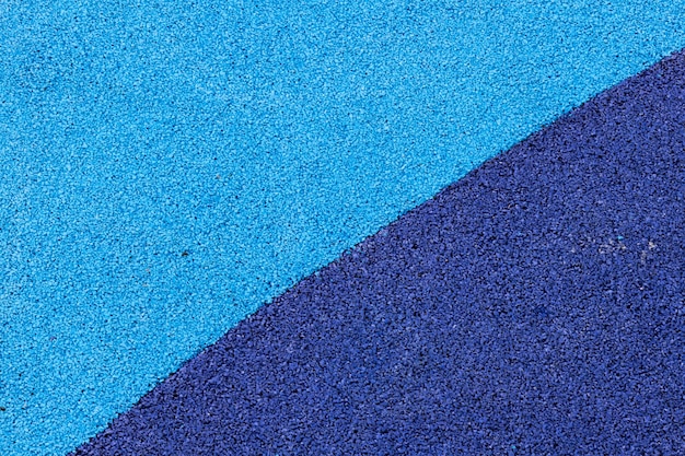 Textura de pista de atletismo azul y negro. Fondo y textura para el diseño.