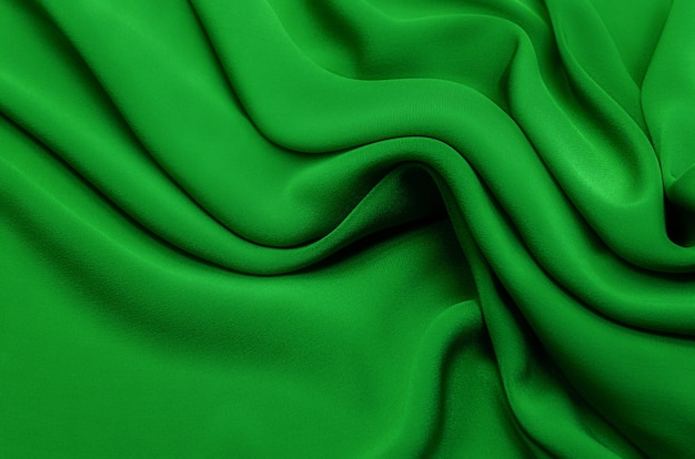 Textura, plano de fundo, padrão. Textura de seda verde ou tecido de algodão ou lã. Belo padrão de tecido.