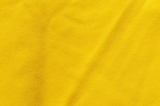 Textura de poliéster de tela de color amarillo y fondo textil