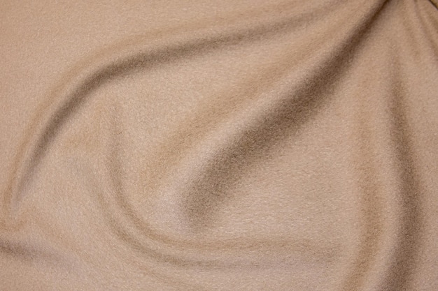 Textura de primer plano de tela beige natural o tela en color marrón Textura de tela de algodón natural o material textil de lino Fondo de lona beige