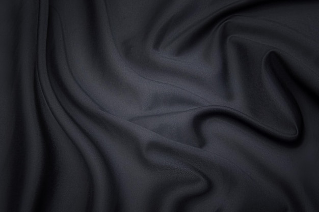 Textura de primer plano de tela gris natural o tela en color negro Textura de tela de algodón natural o material textil de lino Fondo de lona gris o negro
