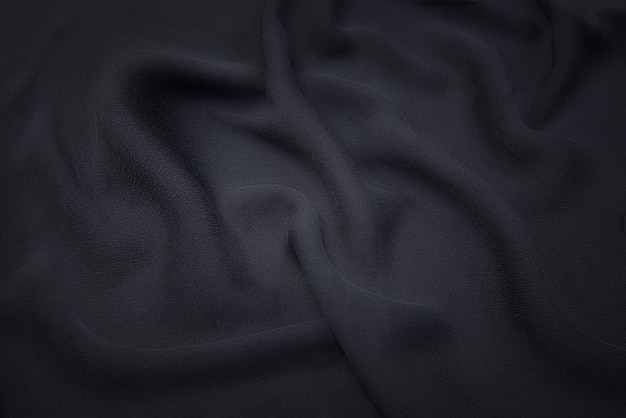 Textura de primer plano de tela o paño gris natural en color gris. Textura de tela de material textil de lino o algodón natural. Fondo de lona gris