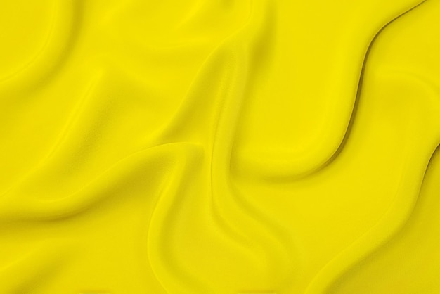 Textura de primer plano de tela o paño naranja o amarillo natural del mismo color. Textura de tela de algodón natural, seda o lana, o material textil de lino. Fondo de lienzo amarillo.