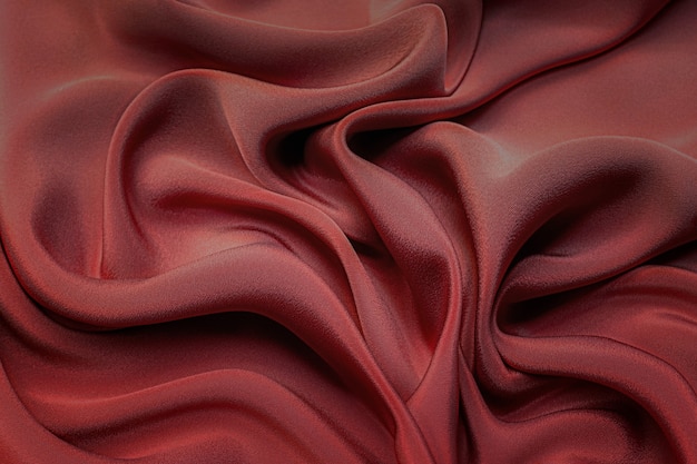 Textura de primer plano de tela roja o carmesí o rosa natural. Textura de tela de algodón natural, seda o lana, o material textil de lino. Fondo de lienzo rojo y naranja.