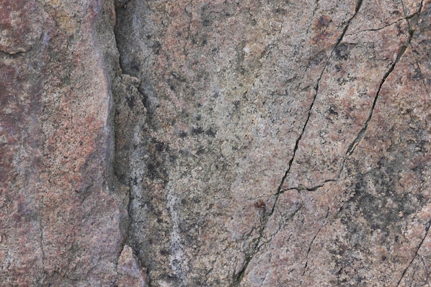 Textura de roca natural Vista de cerca de la superficie texturizada erosionada Piedra marrón o fondo de roca