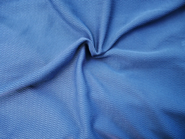 Textura de satén de seda azul, fondo de tela de algodón.
