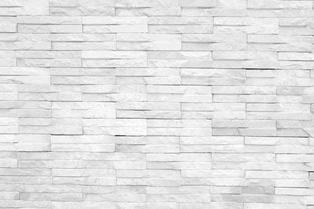 Textura sem costura da parede de pedra branca uma superfície áspera com espaço para texto para um plano de fundo