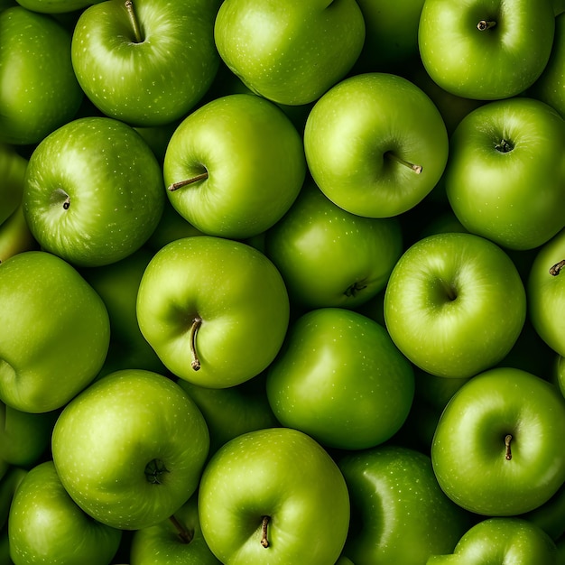 Textura sem costura e fundo de maçãs verdes em pilha com visão de alto ângulo