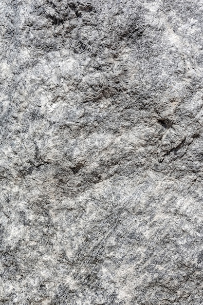 La textura de la superficie de cuarzo gris Un patrón sobre una roca Fondo de piedra natural