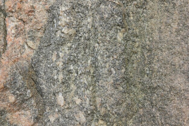 La textura de la superficie erosionada de la roca de piedra antigua Detalle de la naturaleza de las rocas Primer plano de la pared de piedra marrón áspera