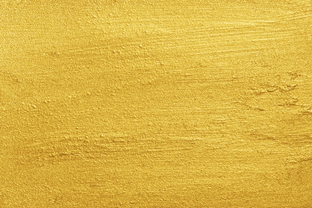 Textura de superficie rugosa pintada de amarillo dorado dorado