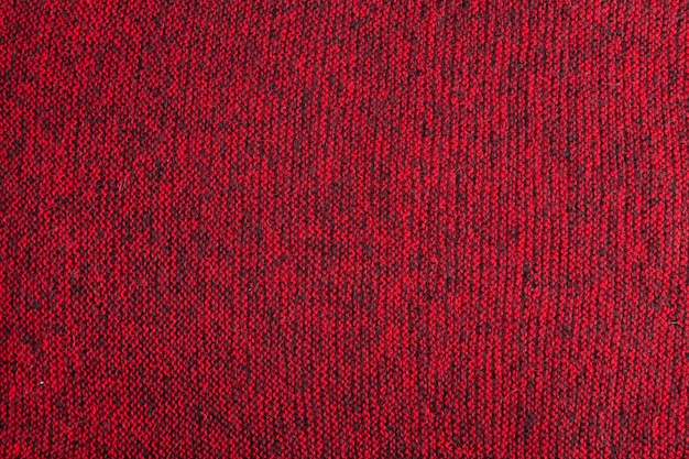 Textura tejida melange roja y negra y fondo plano