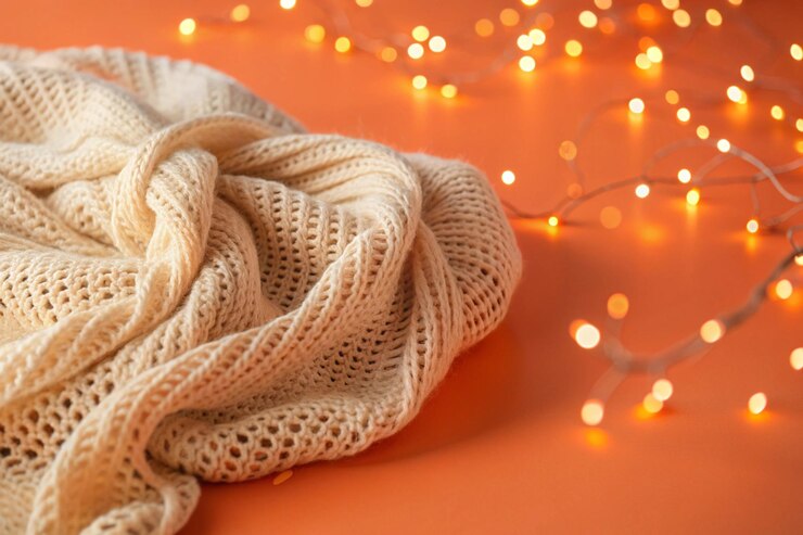 Una textura tejida que imita sutilmente una tela tejida a mano luces bokeh pastel flotan a través de la superficie