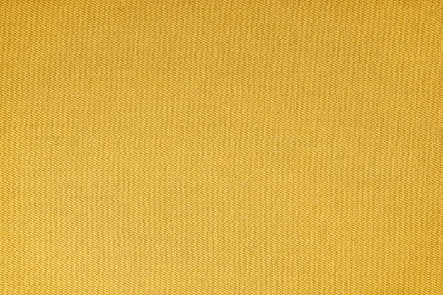 Textura de tejido amarillo patrón de tejido diagonal Fondo textil decorativo