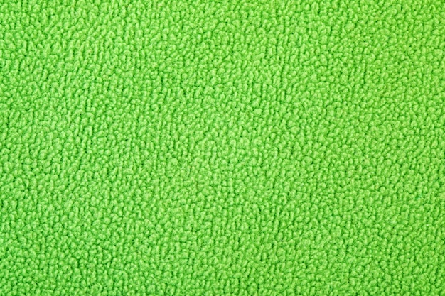 Textura de tejido polar verde tejido suave al tacto agradable a la piel