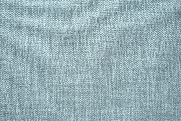 Textura de tela de fondo gris Un trozo de tela de lana está cuidadosamente colocado en la superficie