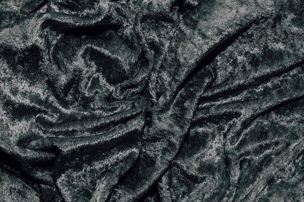 Textura de tela de pana de terciopelo negro con pliegues