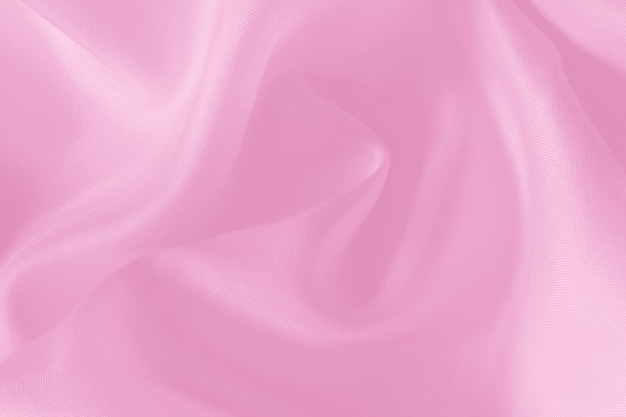 Textura de tela rosa para el fondo y el diseño, hermoso patrón de seda o lino.