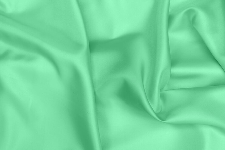 Foto textura de tela de satén verde fondo suavemente borroso