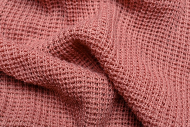 Textura de la tela del suéter rosa