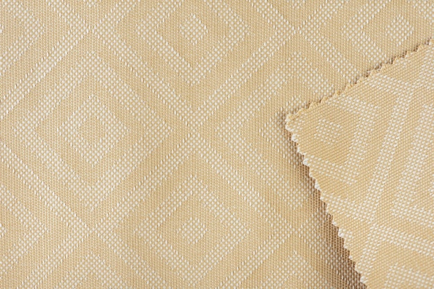 Foto textura de tela para tapizar muebles en color beige con motivos rectangulares o rombos tex