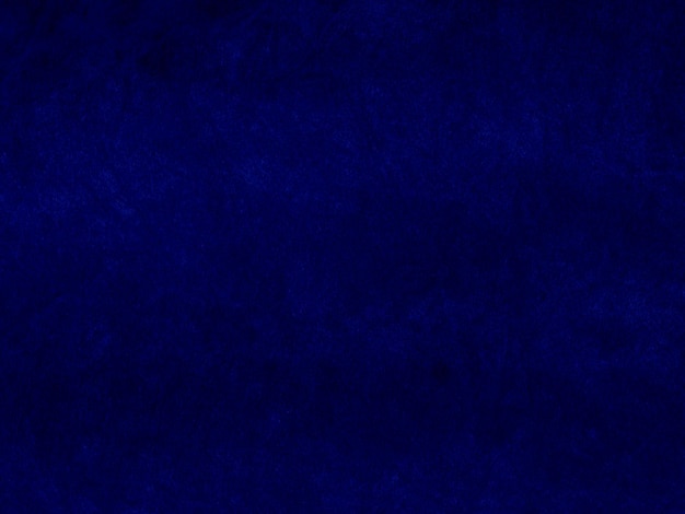 Foto textura de tela de terciopelo azul oscuro utilizada como fondo fondo de tela azul vacío de material textil suave y liso hay espacio para texto