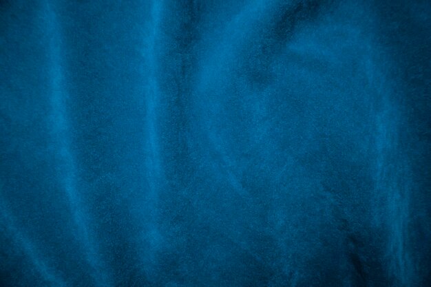 Textura de tela de terciopelo azul utilizada como fondo Fondo de tela azul de material textil suave y liso Hay espacio para texto