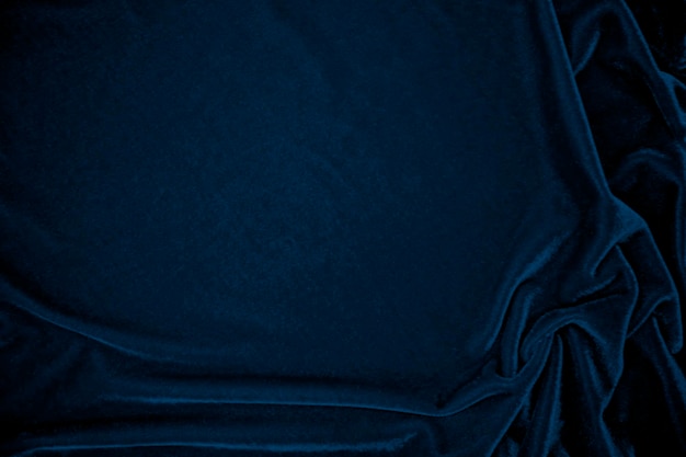 Textura de tela de terciopelo azul utilizada como fondo Tela de panne de color pavo real Fondo de material textil suave y liso Terciopelo triturado Tono azul marino de lujo para seda