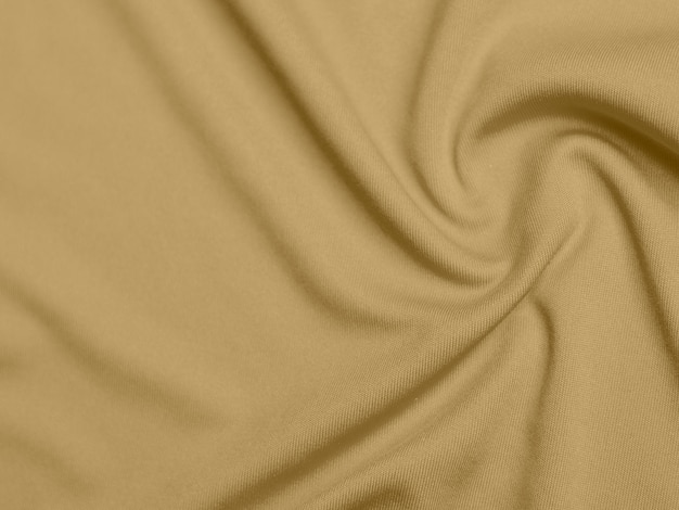 Textura de tela de terciopelo de color dorado utilizada como fondo de tela de color rubio suave y liso