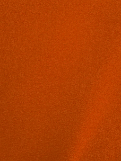 Textura de tela de terciopelo naranja utilizada como fondo Fondo de tela naranja claro vacío de material textil suave y liso Hay espacio para texto