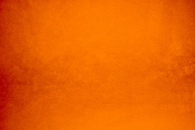 Foto textura de tela de terciopelo naranja utilizada como fondo tela de panne de color naranja fondo de material textil suave y liso terciopelo triturado de lujo tono naranja para gradiente de seda