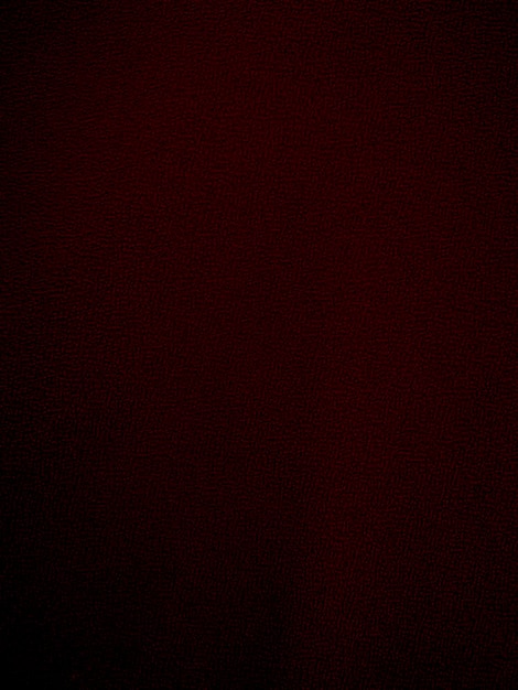 Foto textura de tela de terciopelo rojo oscuro utilizada como fondo fondo de tela rojo oscuro vacío de material textil suave y liso hay espacio para textx9