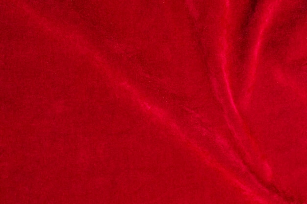 Textura de tela de terciopelo rojo utilizada como fondo fondo de tela roja de material textil suave y liso Hay espacio para textx9