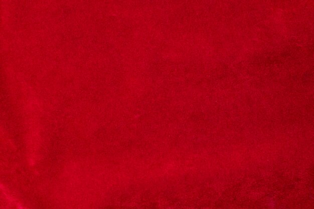 Textura de tela de terciopelo rojo utilizada como fondo fondo de tela roja de material textil suave y liso Hay espacio para textx9