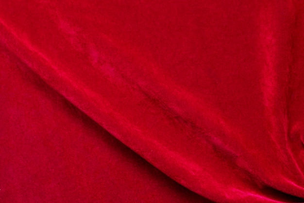 Textura de tela de terciopelo rojo utilizada como fondo fondo de tela roja de material textil suave y liso Hay espacio para textx9