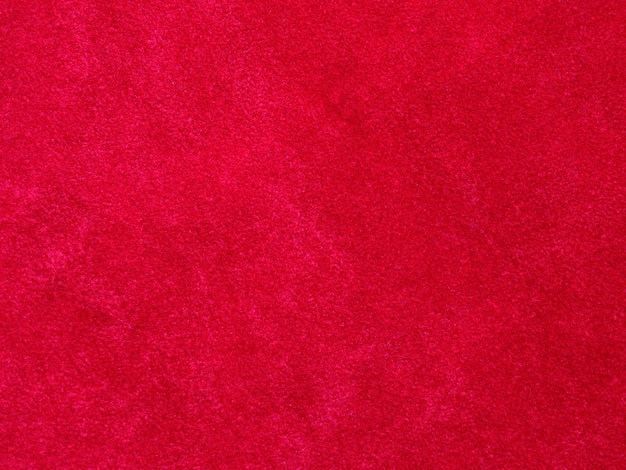 Textura de tela de terciopelo rojo utilizada como fondo Fondo de tela roja vacía de material textil suave y liso Hay espacio para texto