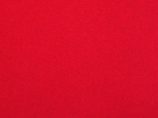 Textura de tela de terciopelo rojo utilizada como fondo Fondo de tela roja vacía de material textil suave y liso Hay espacio para texto