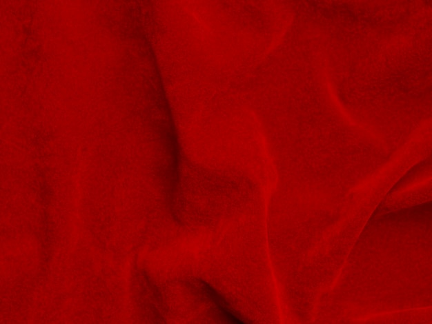 Textura de tela de terciopelo rojo utilizada como fondo Fondo de tela roja vacía de material textil suave y liso Hay espacio para texto