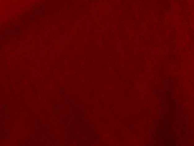 Textura de tela de terciopelo rojo utilizada como fondo Fondo de tela roja vacía de material textil suave y liso Hay espacio para texto